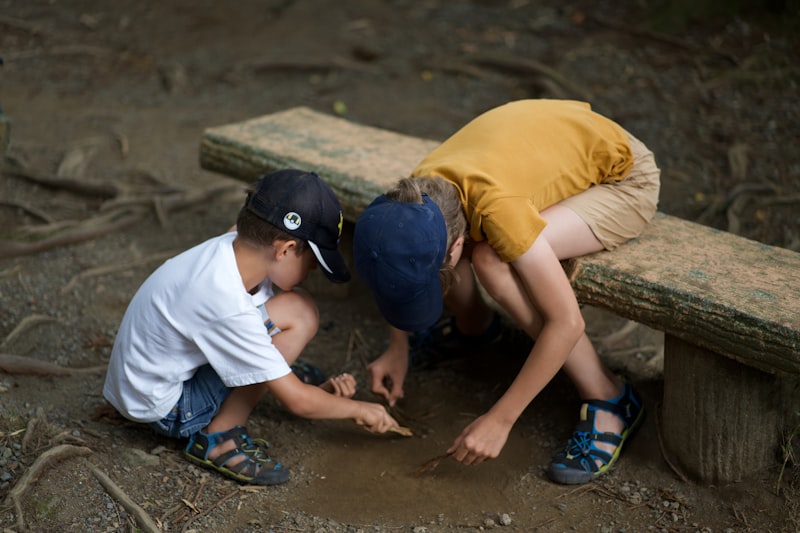 Two children exploring nature outdoors